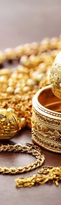Beautiful golden jewelry on grey background